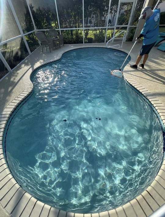 Pool service technician on site